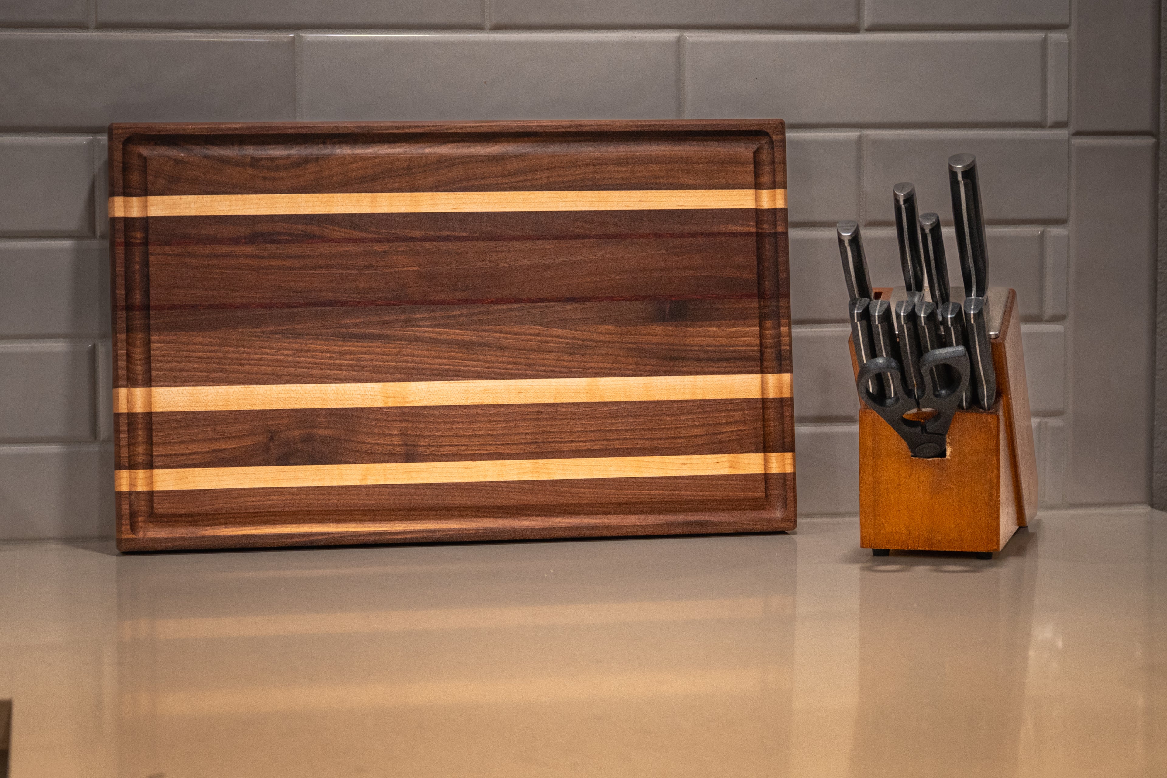 Walnut, Maple, Padauk Edge Grain Cutting Board