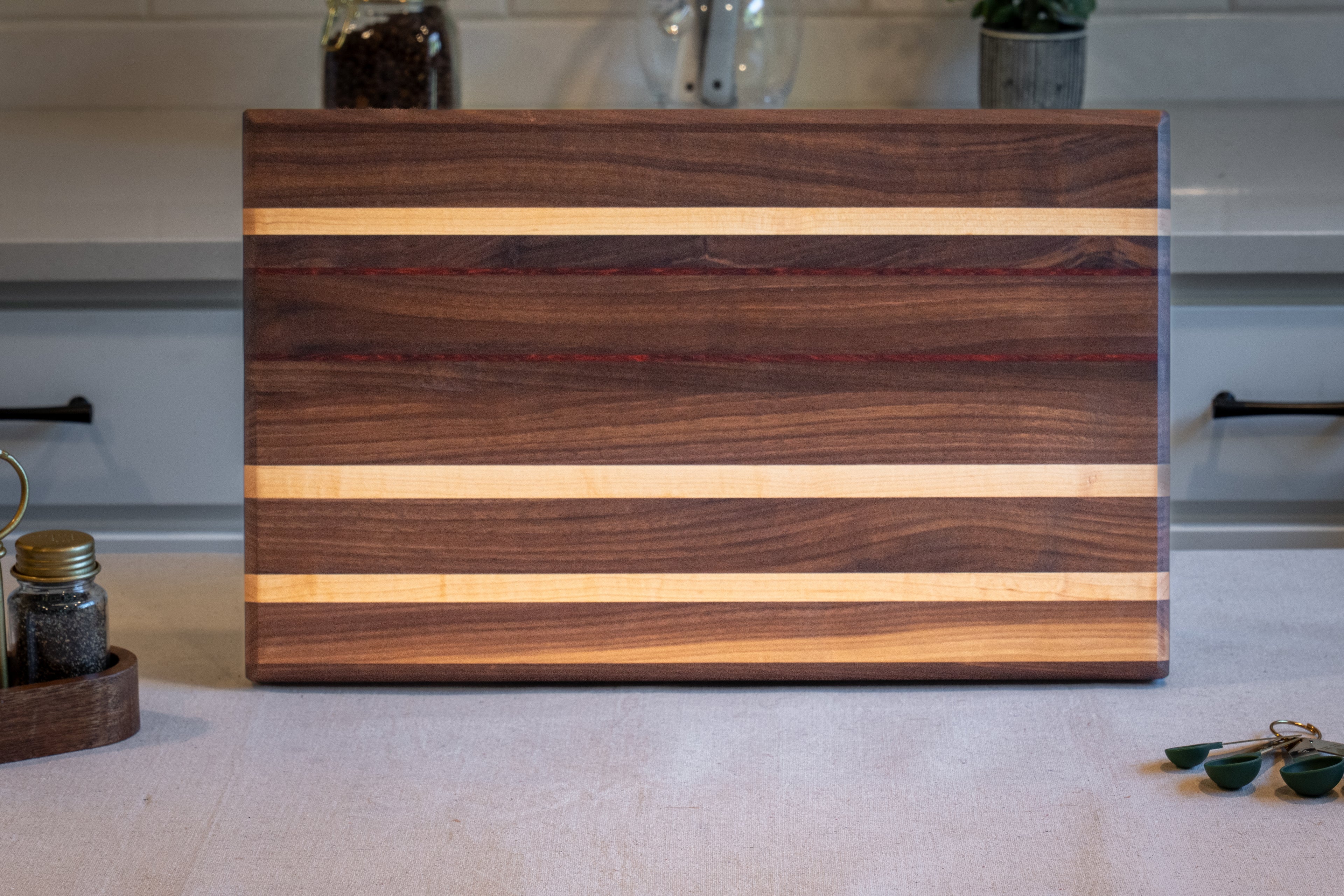 Walnut, Maple, Padauk Edge Grain Cutting Board