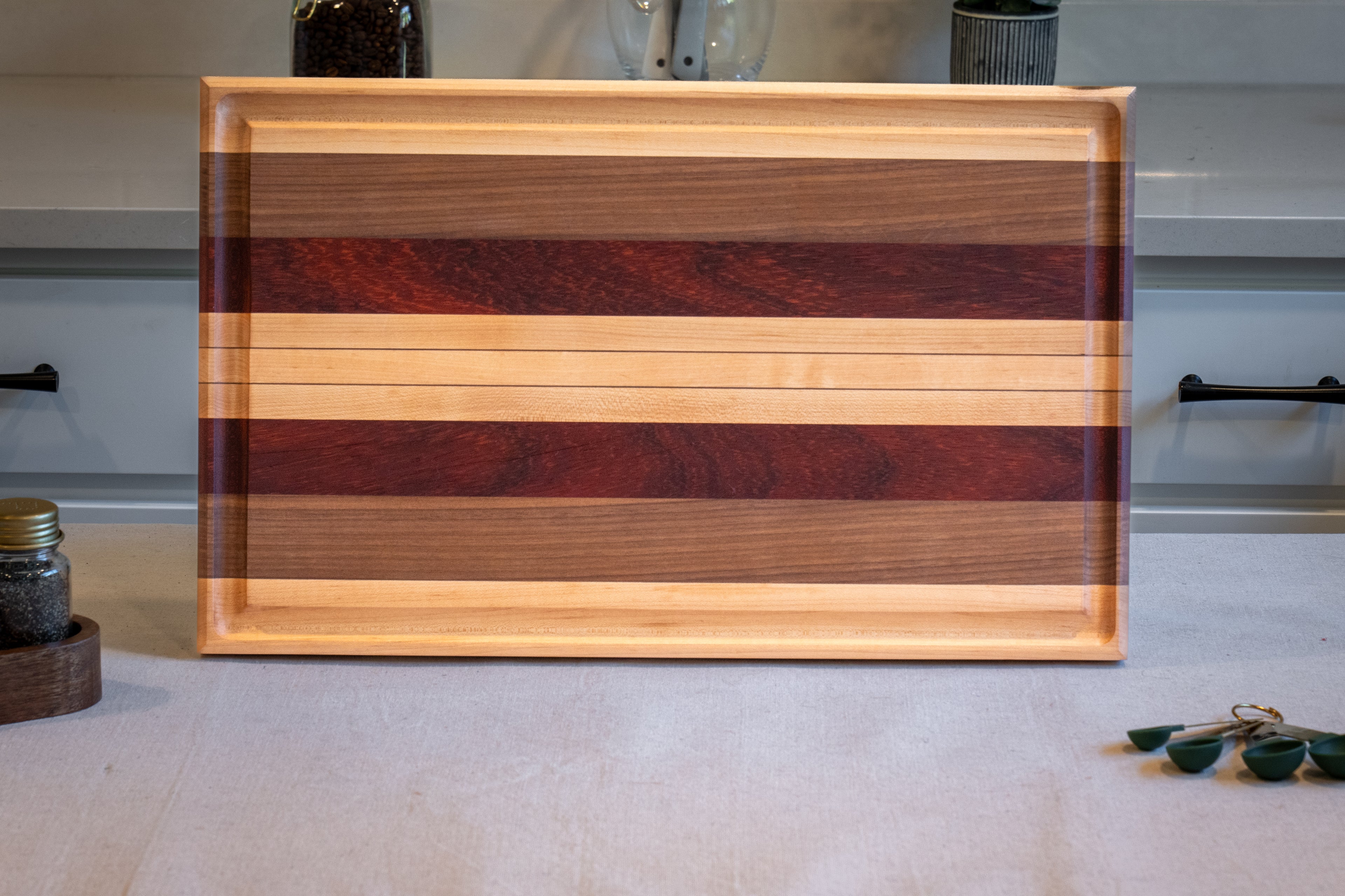 Walnut, Maple, Padauk Edge Grain Cutting Board
